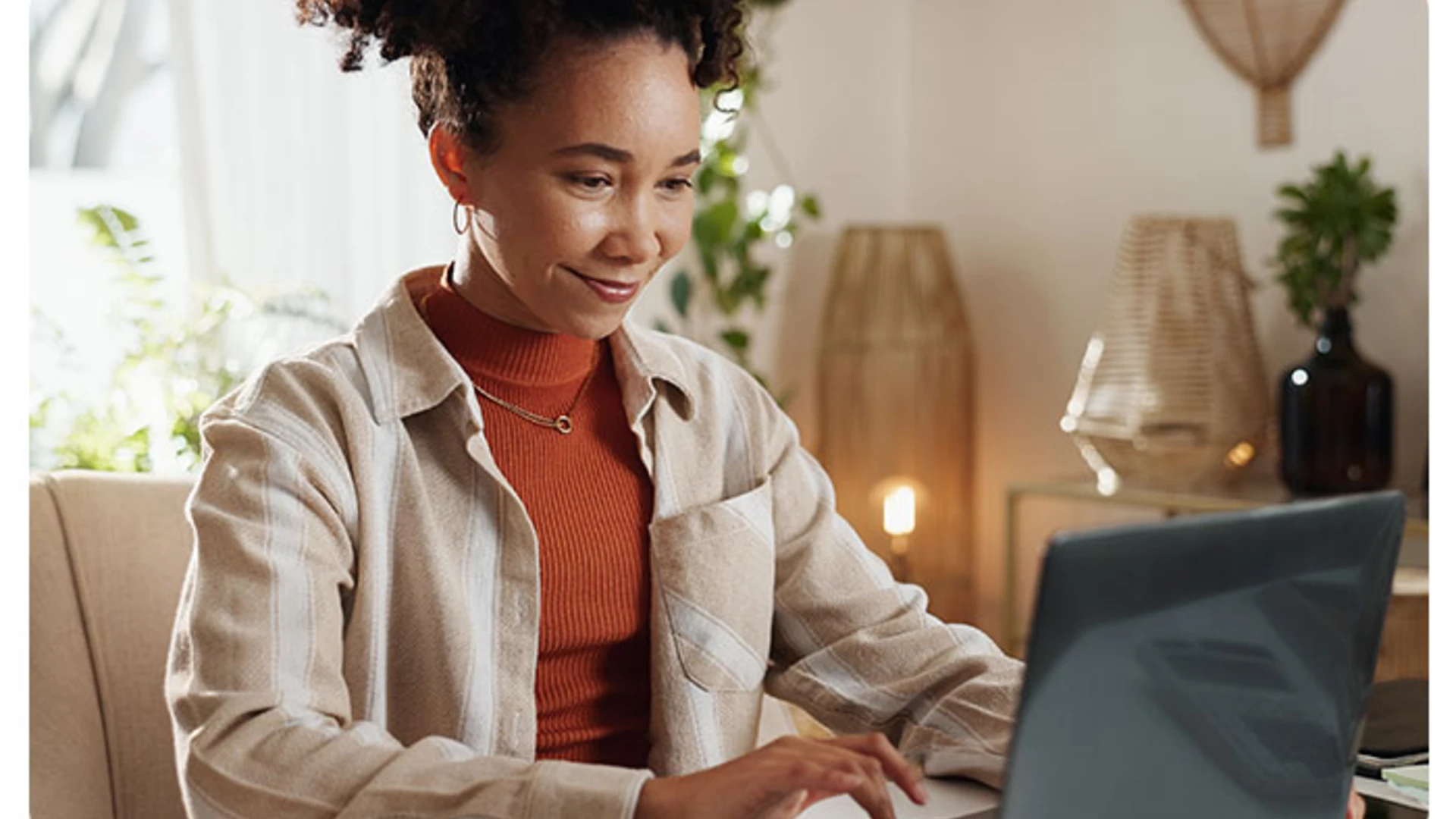 female working from home on laptop