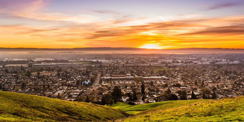 Aerial view of a suburban city at sunset - hero image of multi page site